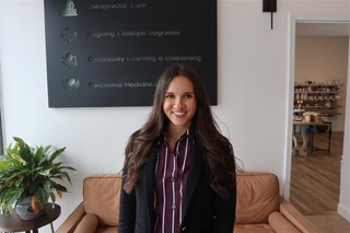 Smiling woman in professional setting.