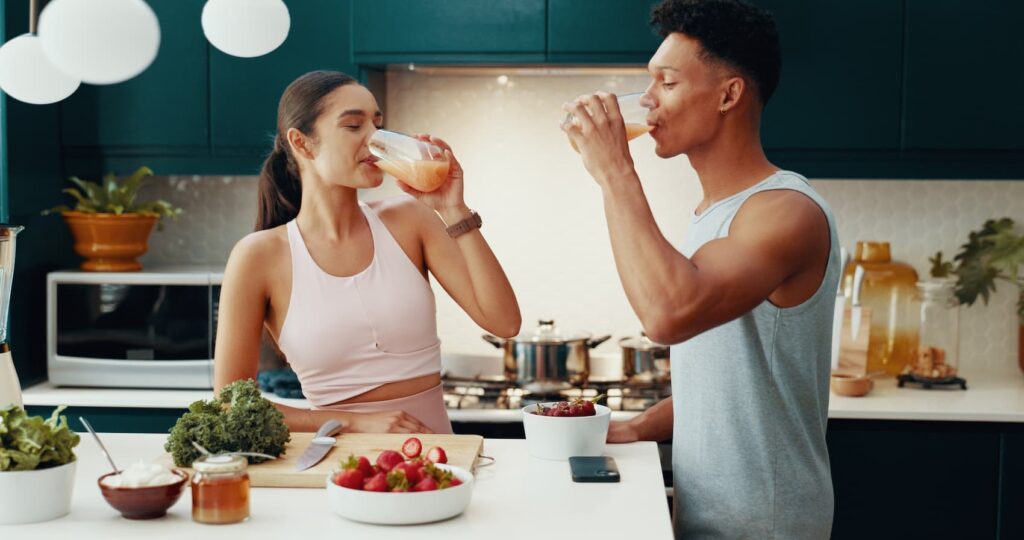 Couple enjoying healthy smoothies together.