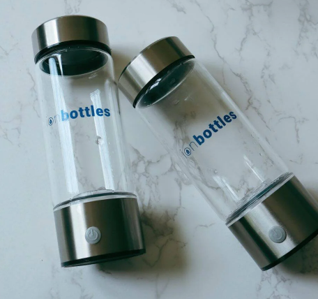 Two transparent water bottles on surface