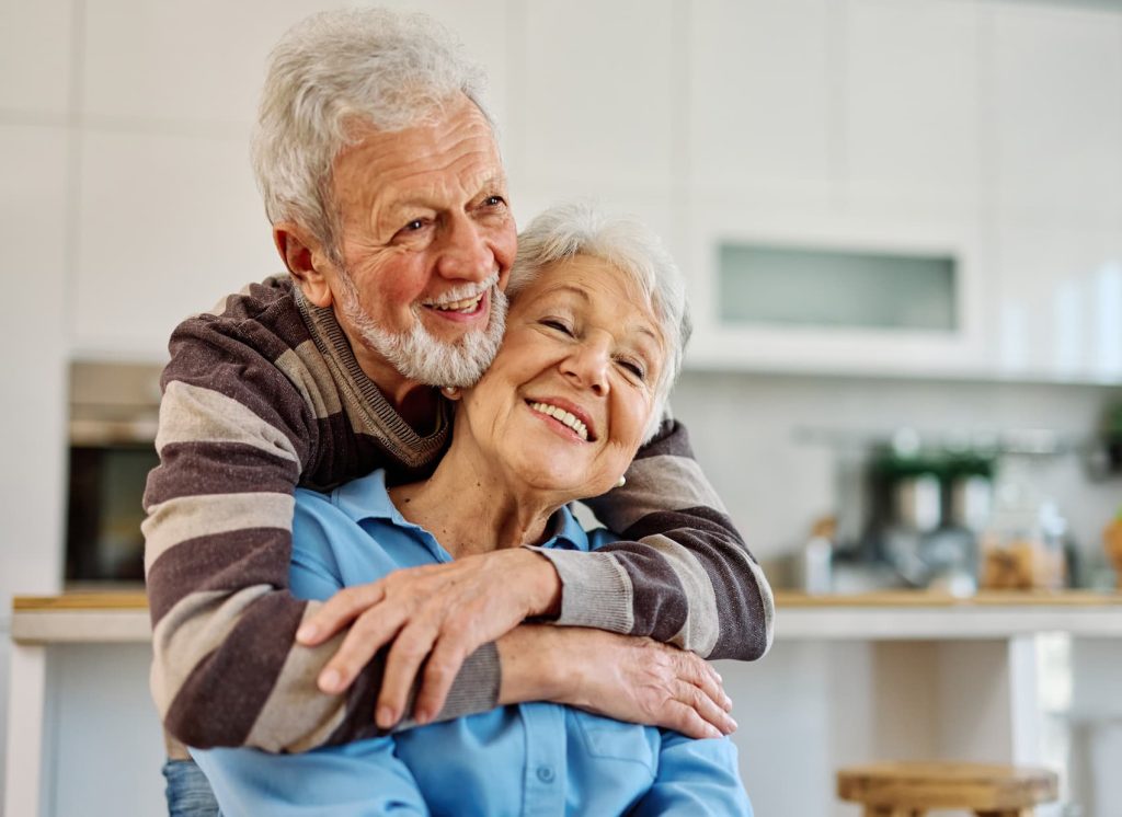 Elderly couple sharing a joyful moment.